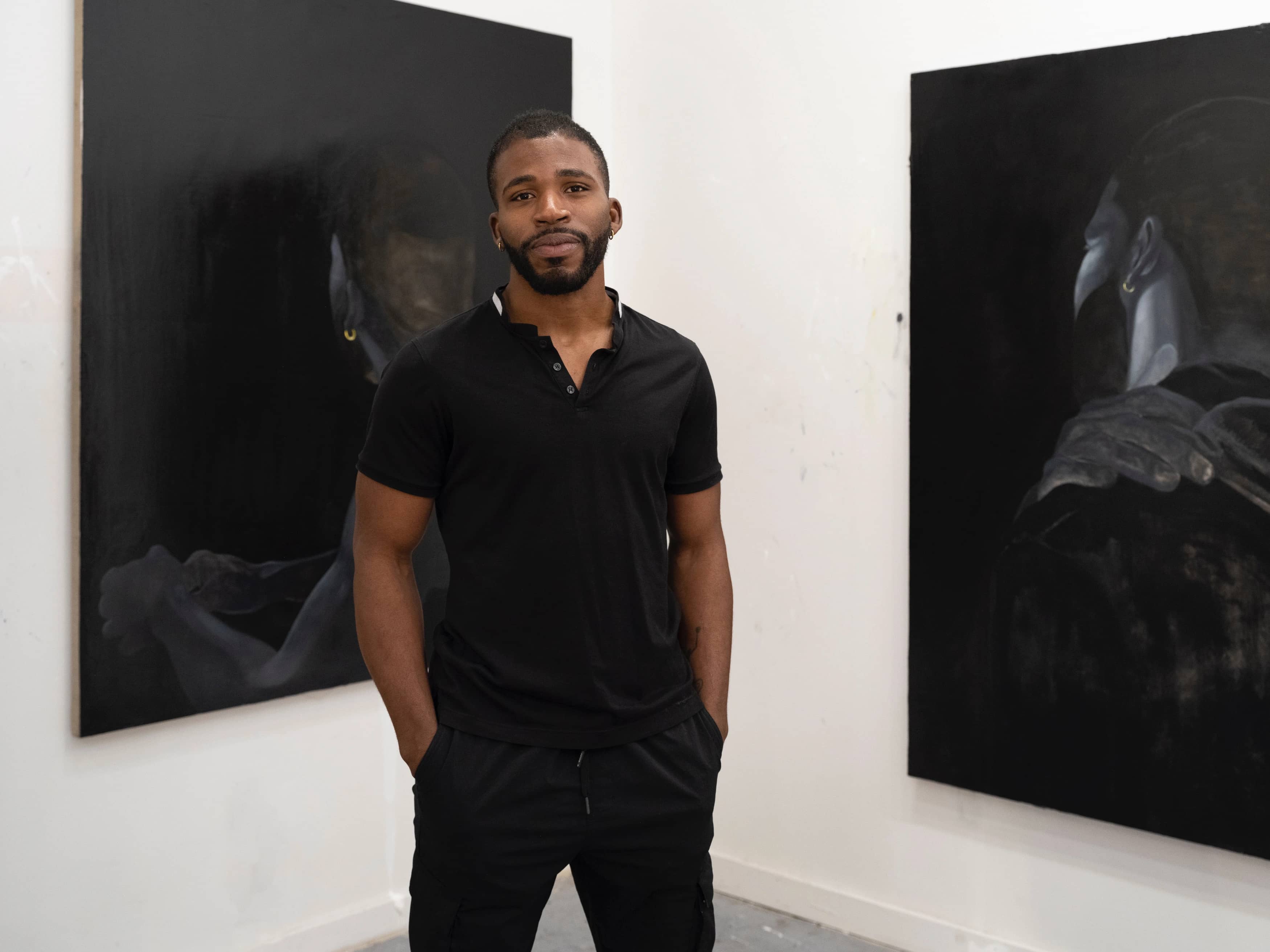 Dominic Chambers with paintings