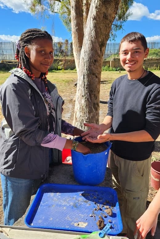 flieldwork with pail Students floating soil