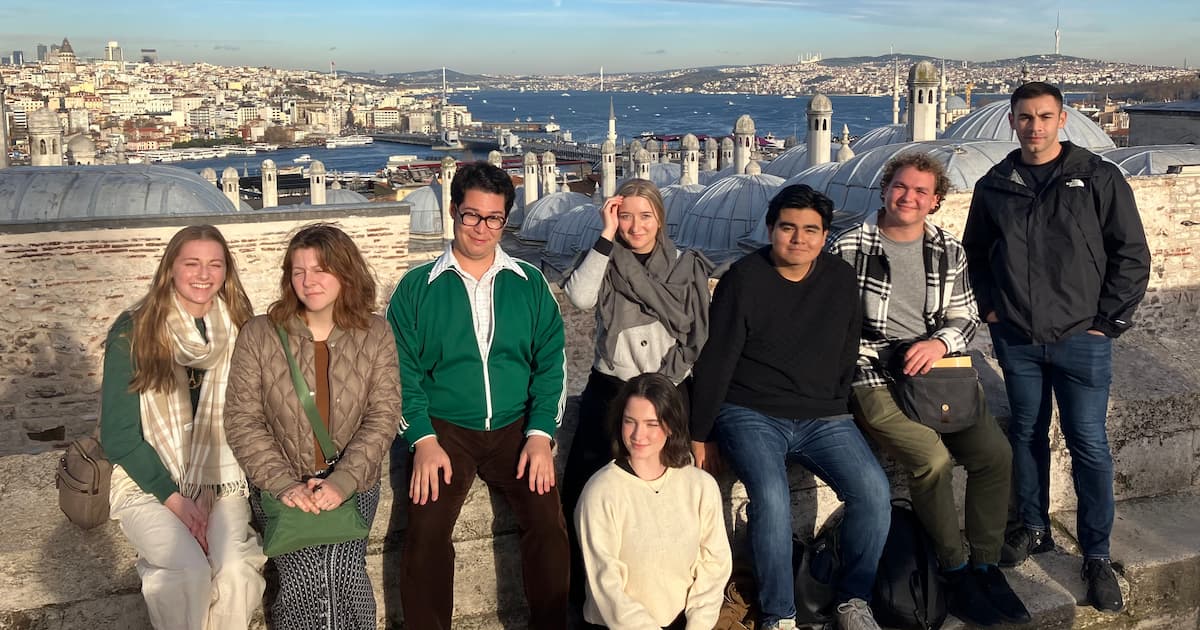 Students on a rooftop with the Bosphorus in the background