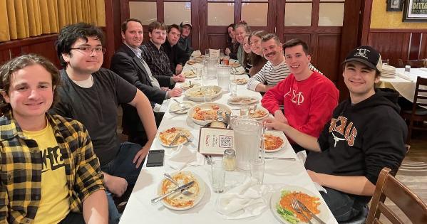 Class at Carmine's eating a delicious family-style lunch.