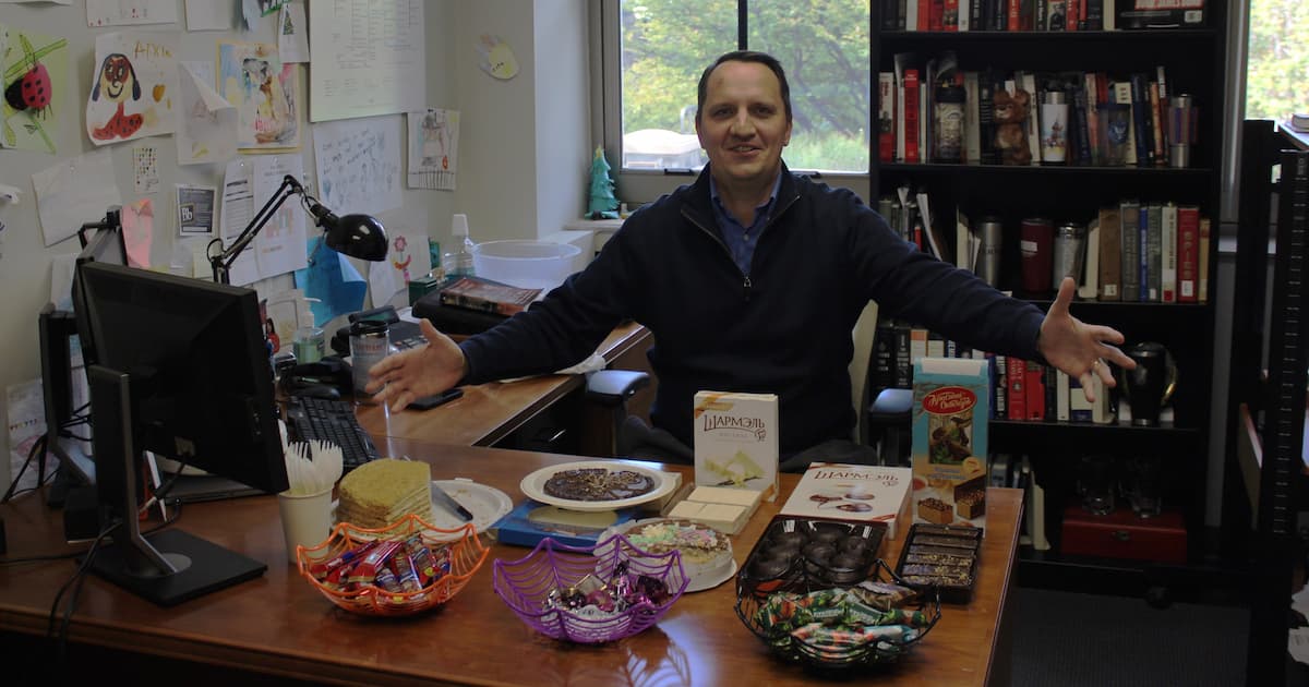 Professor Fedyashin with Russian candies displayed on his office desk.
