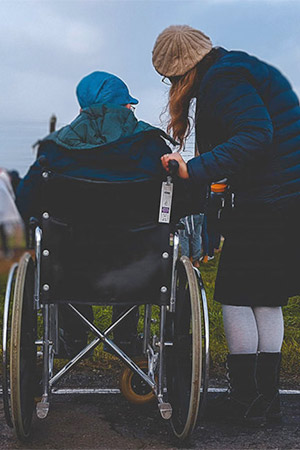 Care worker and wheelchair.