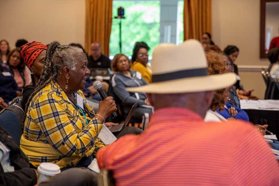 Participants discuss farming, food, and equity issues at Farm Bill Summit. Photo by Austin Price