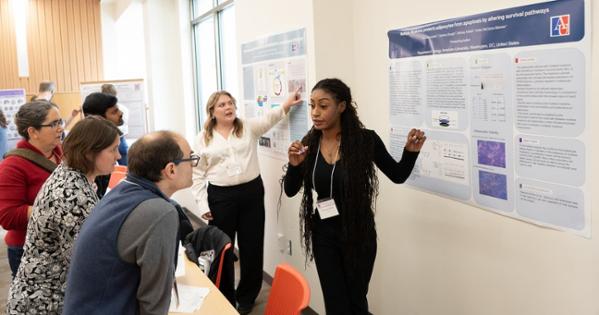 Students present posters to audience at Mathias Student Research Conference