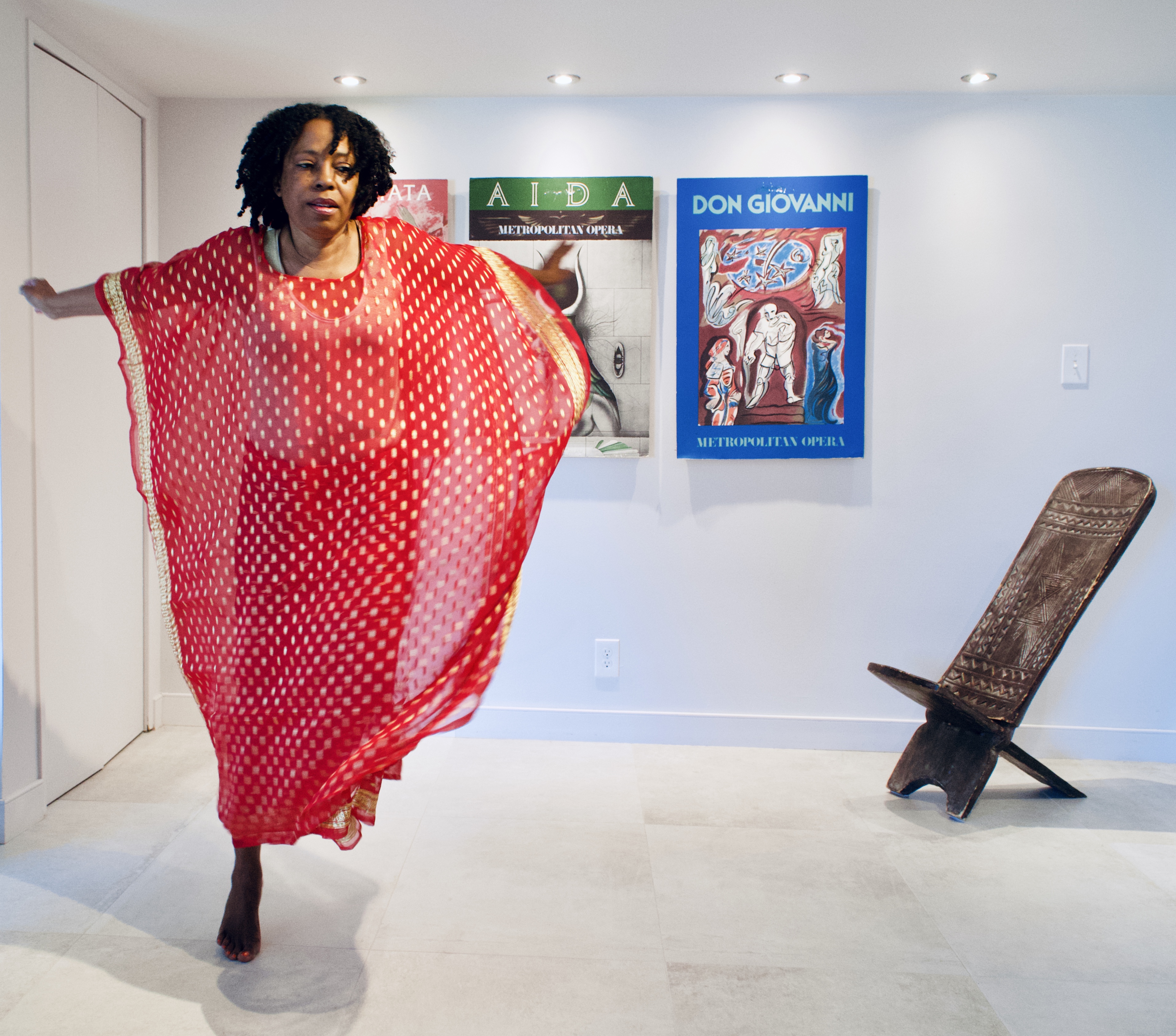 Marcia Howard dances next to a sculpture