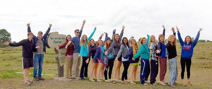 Students stand on the equator in Kenya