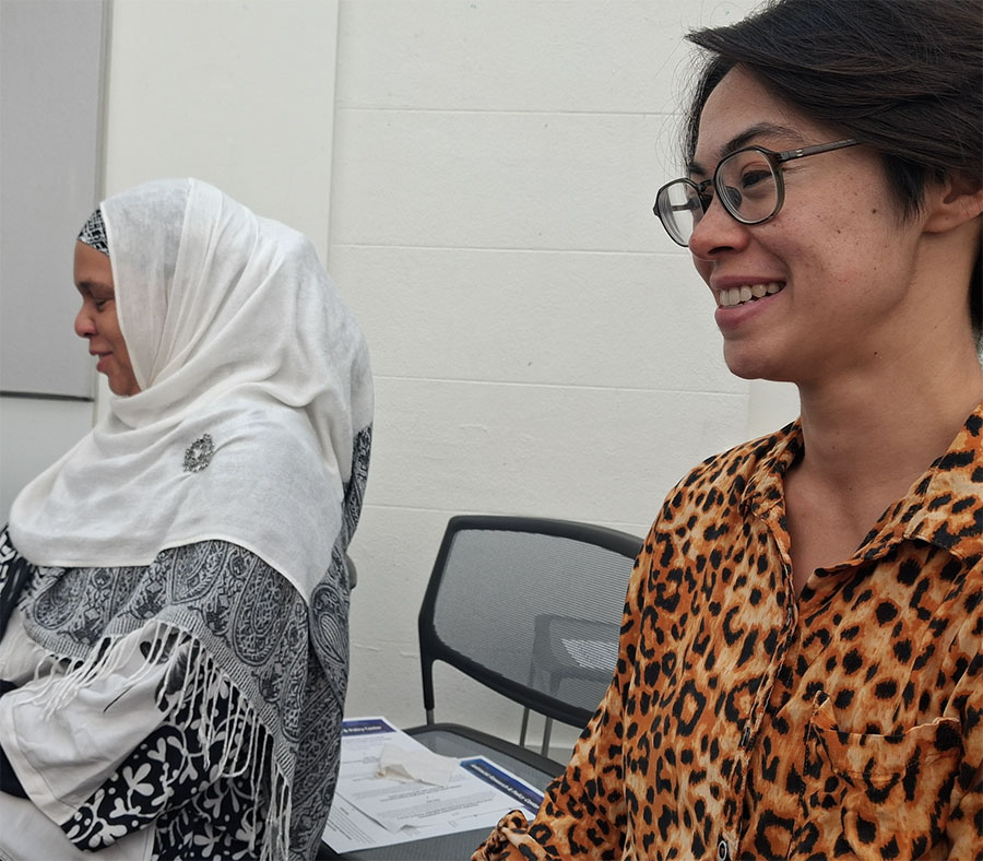 School of Ed. Professor Amaarah Decuir and Sociology Professor Sarah Iverson watch a short film by student J-Lin De Los Santos.