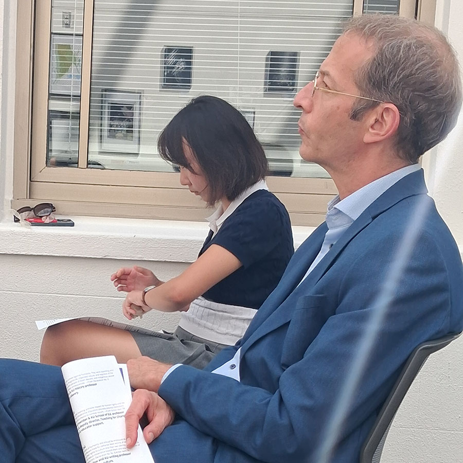 History Professor Max Friedman and a student listen to Dr. Rao discuss his book.