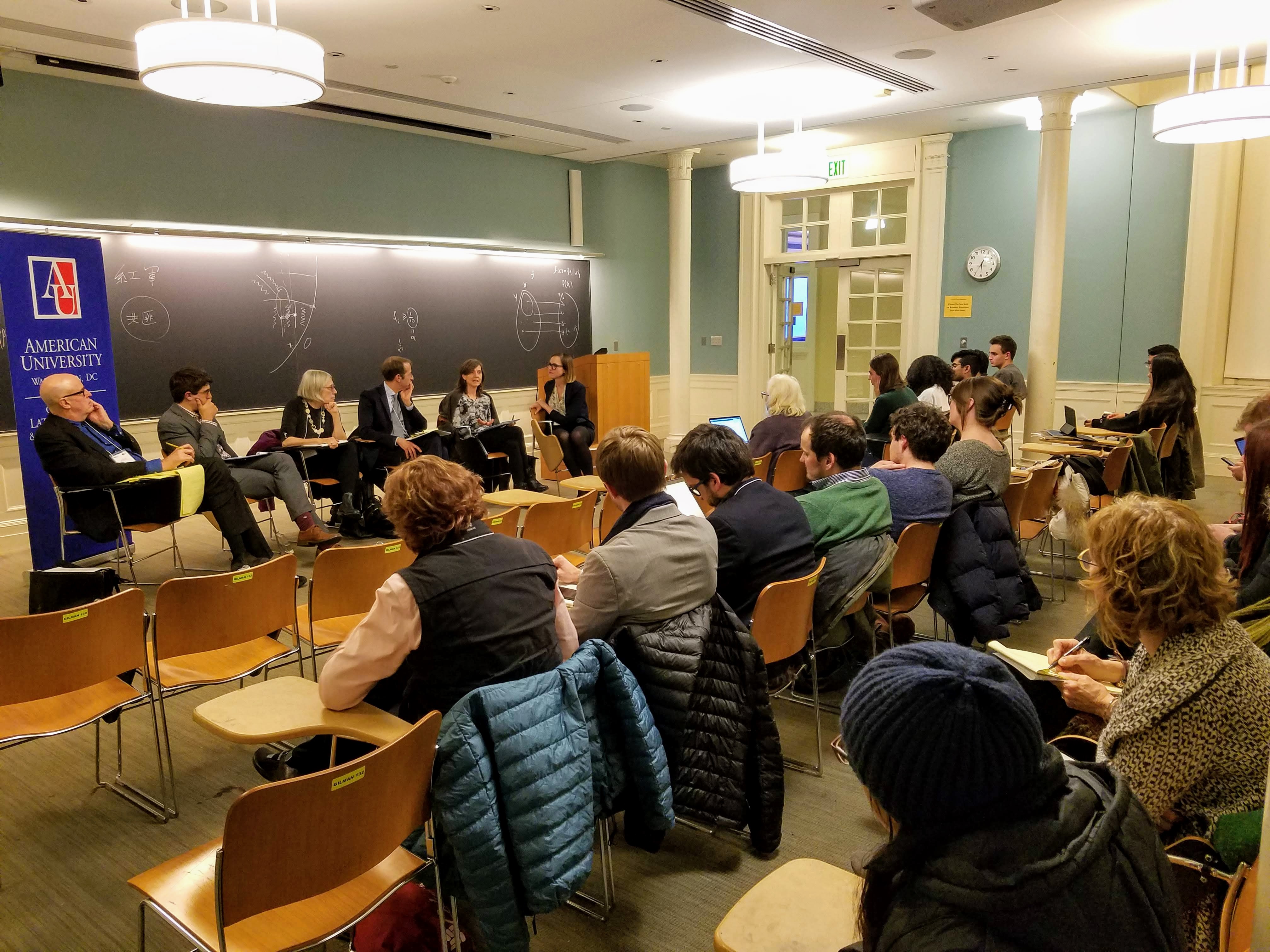 Panelists speaking at Johns Hopkins University