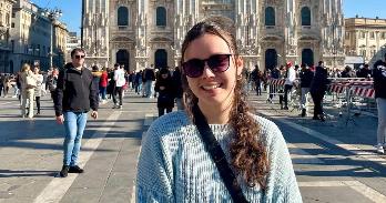 Hannah VanWagner, a student, in sunglasses with Milan Duomo in background.