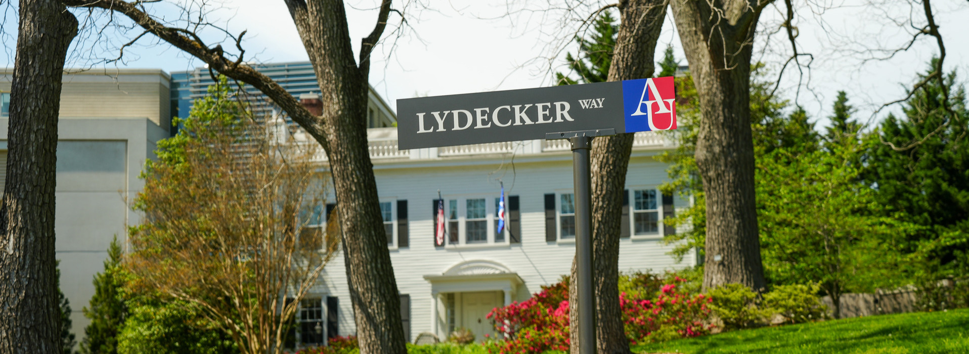 The signage for "Lydecker Way" in front of the President's House on AU's campus.