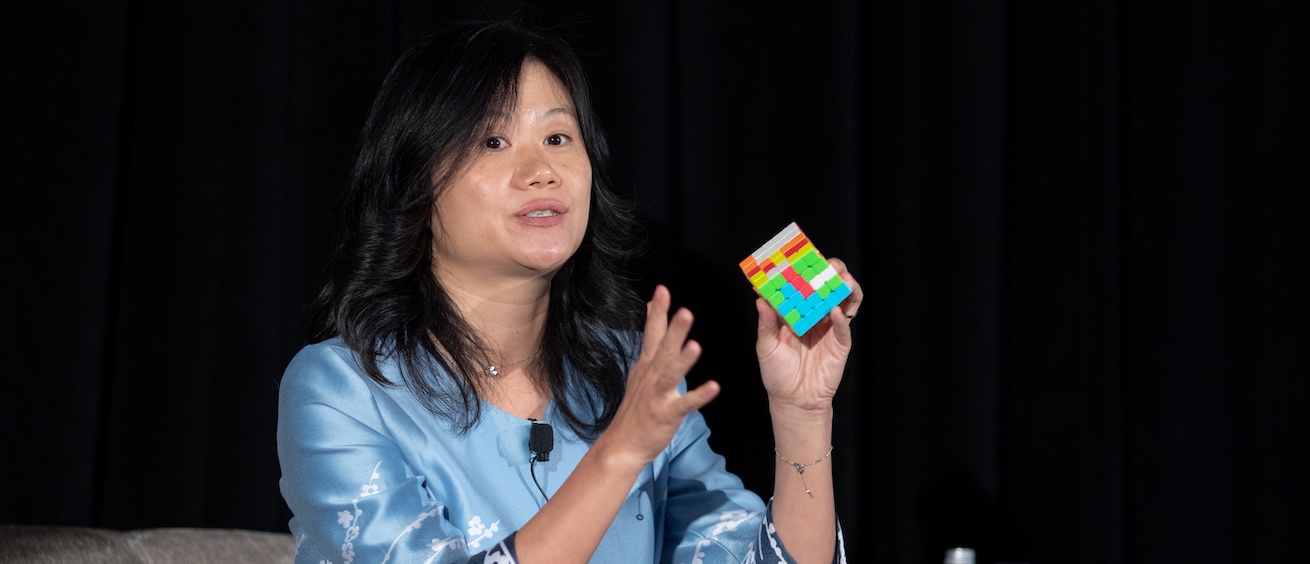 Professor Heng Xu with a Rubik's Cube