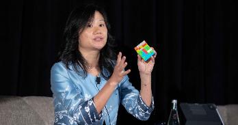 Professor Heng Xu with a Rubik's Cube