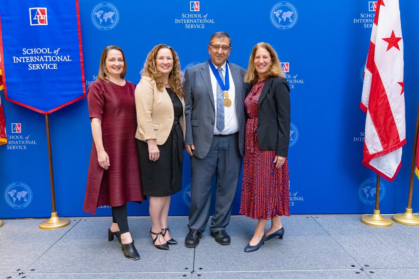 (From left to right) SIS Dean Shannon Hader, Acting Provost and Chief Academic Officer Vicky Wilkins, Professor Mohammed Abu-Nimer, AU President Sylvia M. Burwell