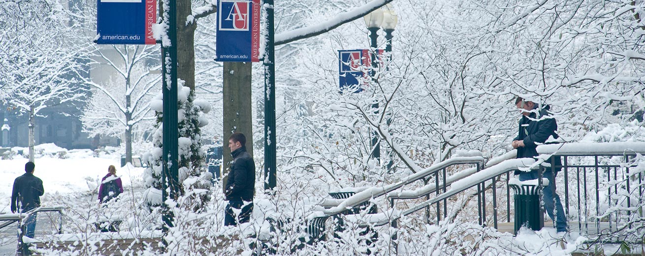 Students walk around Kogod and the quad in snow