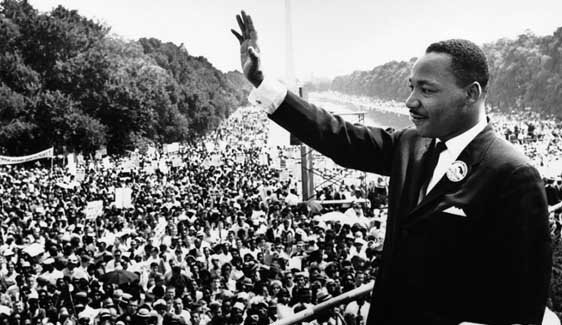 Dr. Martin Luther King, Jr., waving to people at the March on Washington for Jobs and Freedom
