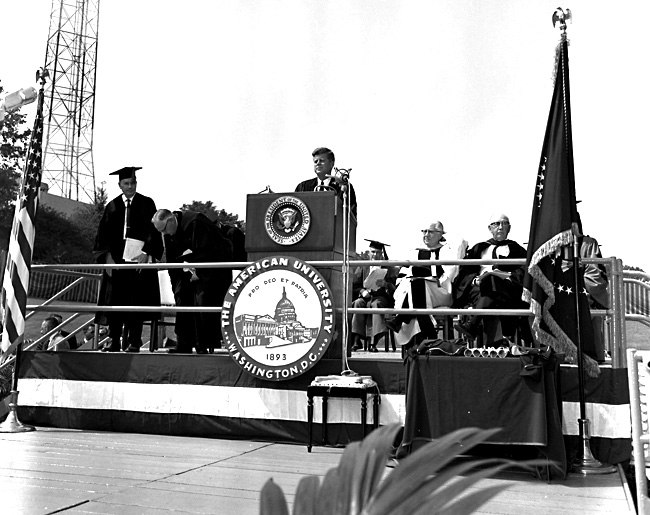 JFK approaches the podium to give the now famous commencement address.