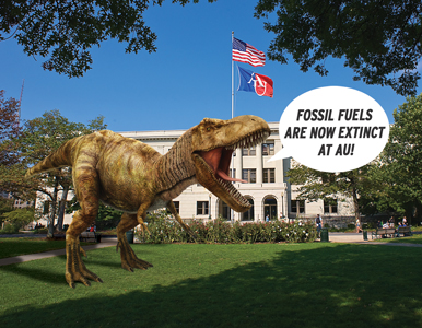 dinosaur in front of Mary Graydon Center proclaiming that fossil fuels are extinct at AU