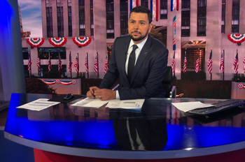 Ayman Mohyeldin behind the anchor desk at MSNBC