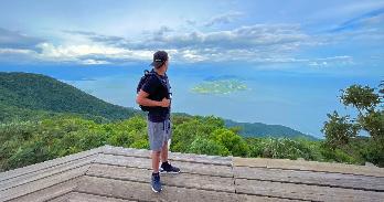 AU student Edwin Santos looks over the ocean while traveling in El Salvador.