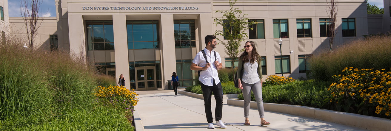 Students walking in front of the Don Myers Technology and Innovation Building