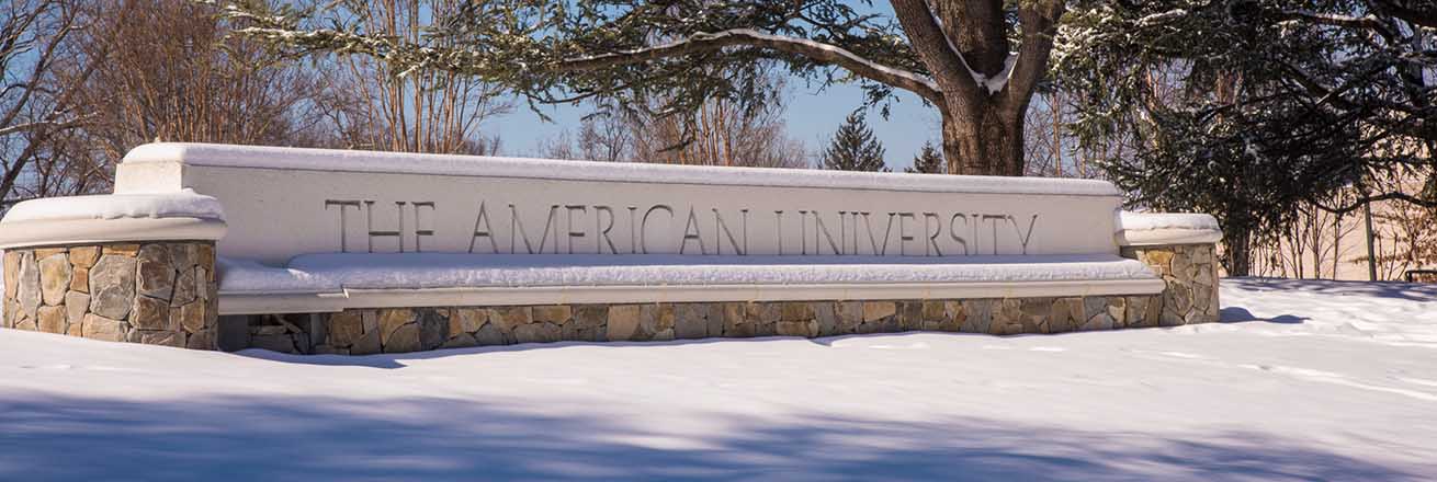 The American University gate covered in snow.