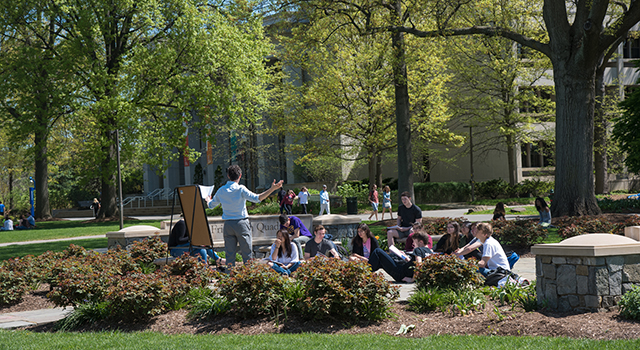 Faculty teaches on the main quad of American University