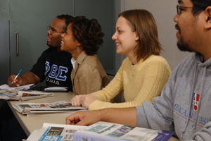 Four Washington Semester Program students sitting in class