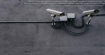 Security cameras mounted on an exterior wall