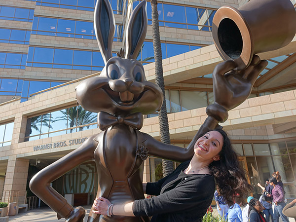 Amanda Ziegler hugging Bugs Bunny statue outside Warner Brothers Studio