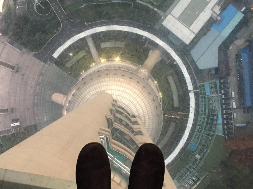 Japaira Ellison standing inside the Pearl TV Tower looking down.
