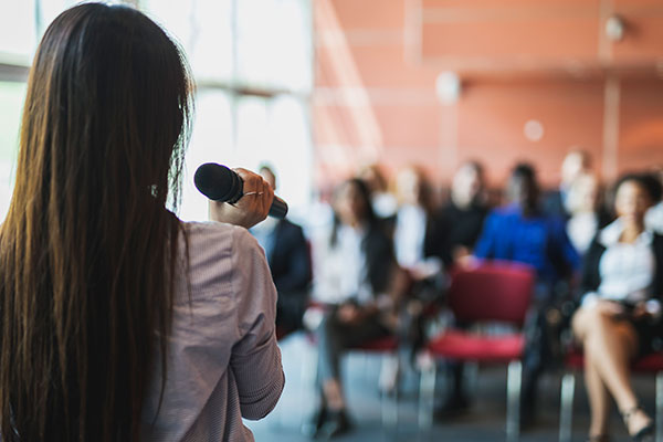 Woman speaking to audience