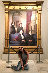 Jessica poses next to a painting at the National Portrait Gallery
