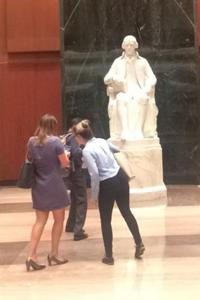 Noelle and friends visiting a famous statue in the Capitol building
