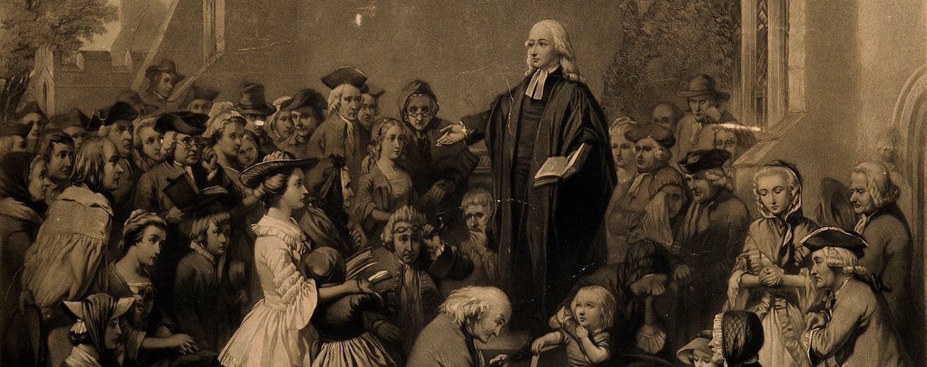 John Wesley preaching outside a church