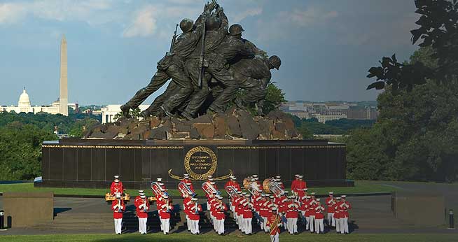 United States Marine Drum and Bugle Corps prepares to play a patriotic tune, June 23, in front of their panoramic backdrop at the Iwo Jima Memorial.