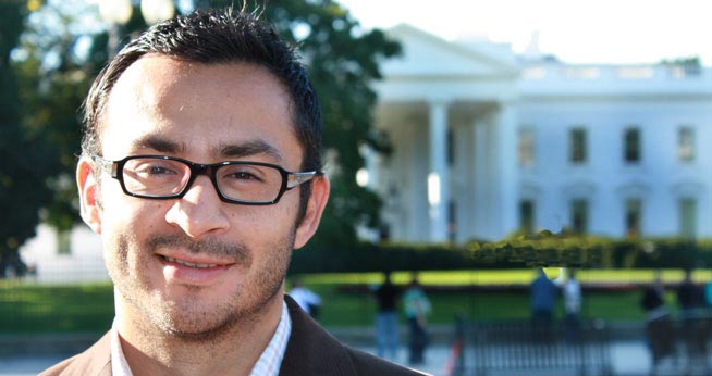 SOC Masters candidate stands in front of the White House