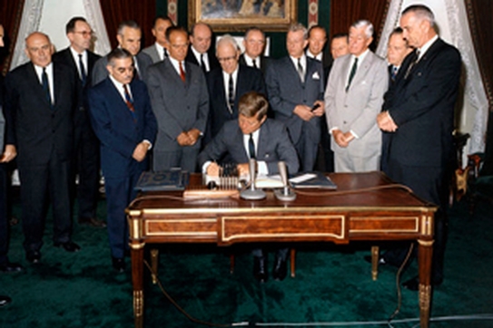 John F. Kennedy signs the limited nuclear test ban treaty