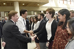 Canadian Prime Minister Justin Trudeau and American University President Neil Kerwin greeting AU students.