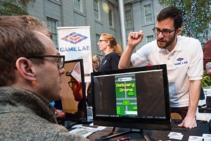 Game Design MA student Cole Wramplemeyer talks with other game professionals and enthusiasts at Indie Arcade.