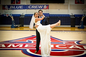 Lisa and Justin recreated a favorite cheerleading pose in Bender Arena on their wedding day.