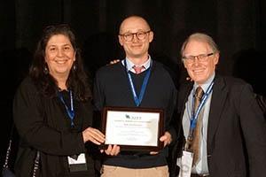 Seth Gershenson, center, accepts the award for Best Research Article.
