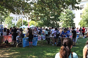 Students gathered around the student clubs and organizations on the Eric Friedheim Quad during the Involvement Fair.
