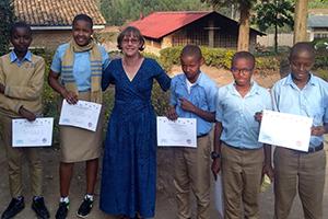 Peace Corps volunteer with school children in Rwanda
