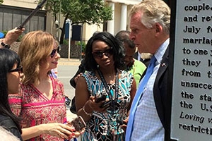 Leena Jayaswal (left) and Caty Borum Chattoo talk with VA Governor Terry McAuliffe (right)