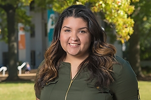 Student trustee Valentina Fernández on the Quad in front of Ward Circle Building.