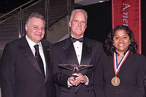 Gary Abramson, SPA/BA ’68, chairman of the Board of Trustees, stands at left with President’s Award recipient Jack Cassell and Cyrus Ansary Medal recipient Esther Benjamin