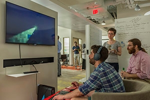 Students playing each other's games at a Game Lab showcase