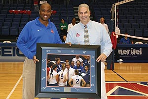 Keith Gill, left, presented volleyball coach Barry Goldberg with a picture to commemorate his 500th carrer win.