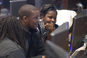 Photo: Brandon Warren and Tamesha Veasley work on the EverFi Financial Literacy Program at the new Kogod School of Business Financial Services and Information Technology Lab.